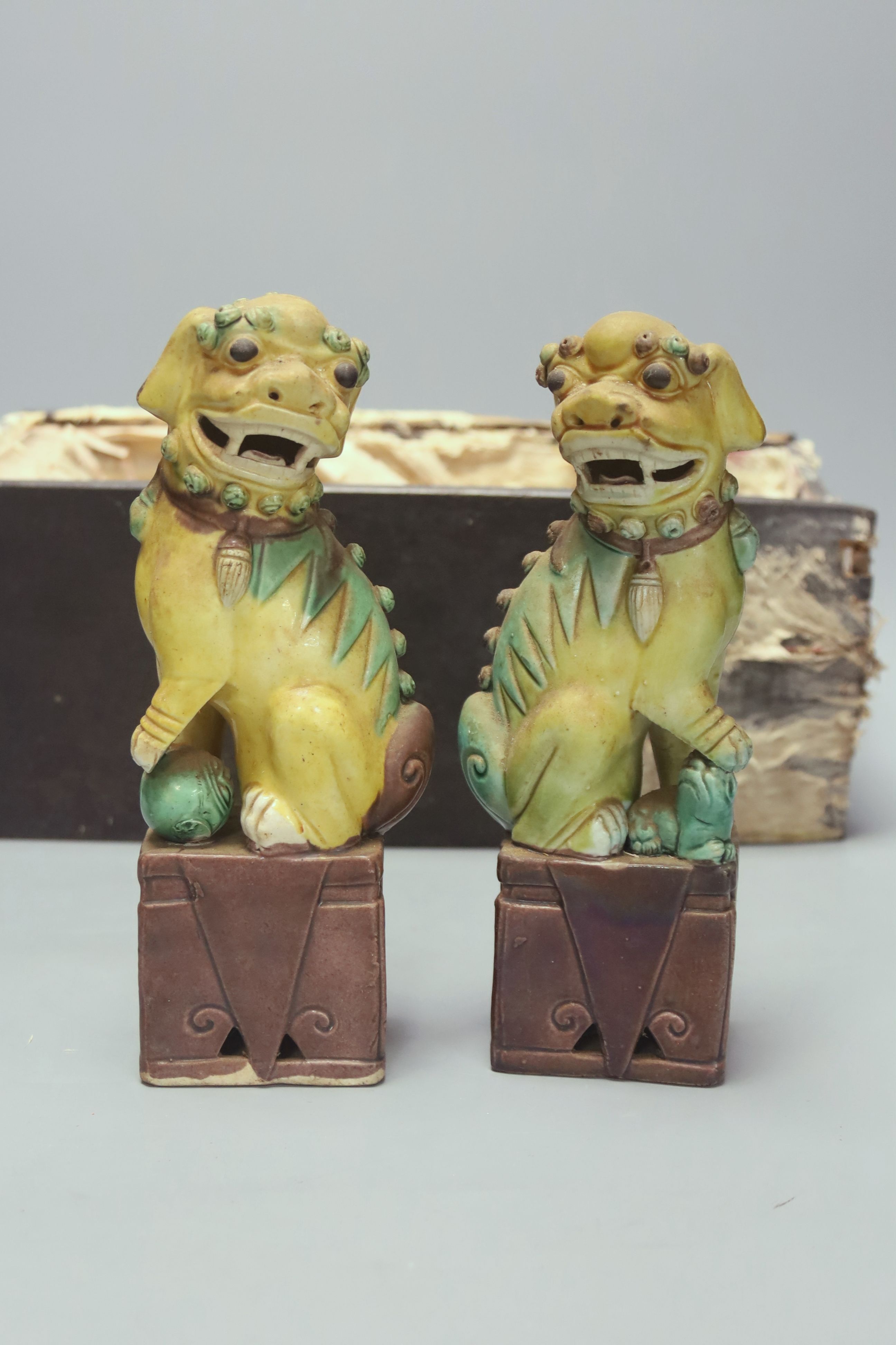 A pair of Chinese lion-dogs dogs, porcelain bowl and a vase, tallest 24cm